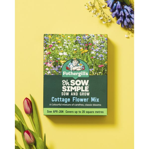 Fothergills cottage flower mix packaging on a yellow background with flowers around