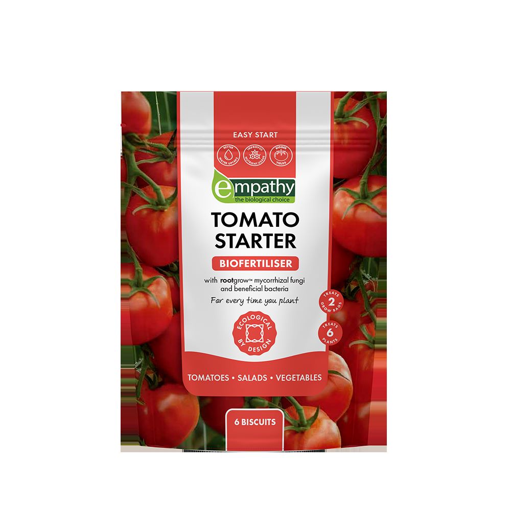 Tomato Starter biofertilizer package with tomatoes on a white background