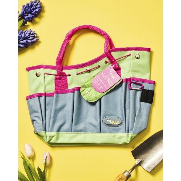 Gardening tool bag with pink and green accents on a yellow background